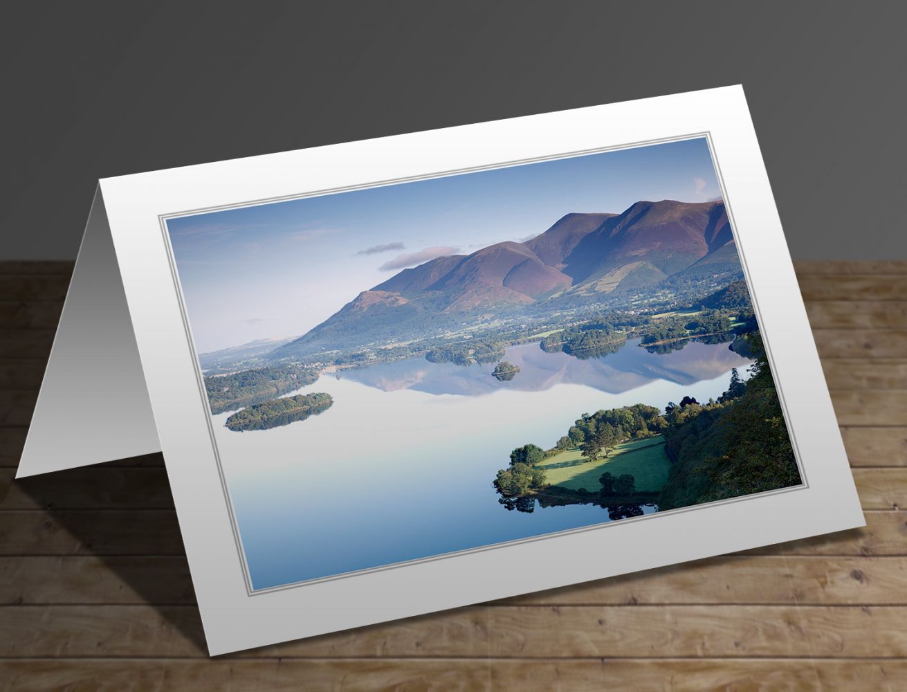 A greetings card containing the image Reflections of Skiddaw and Derwentwater from Surprise View - Martin Lawrence