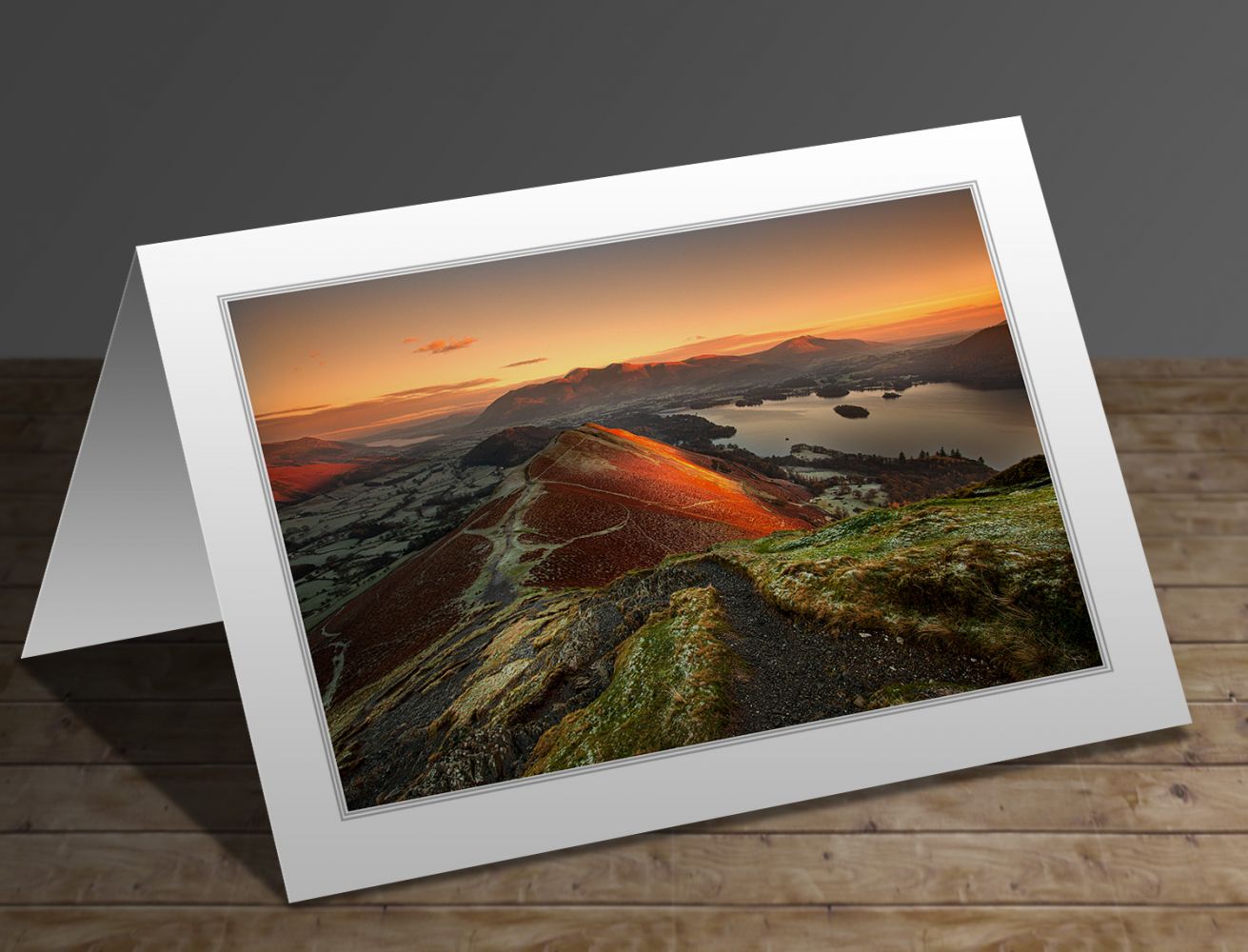 A greetings card containing the image First Light on Catbells and Skiddaw by Martin Lawrence