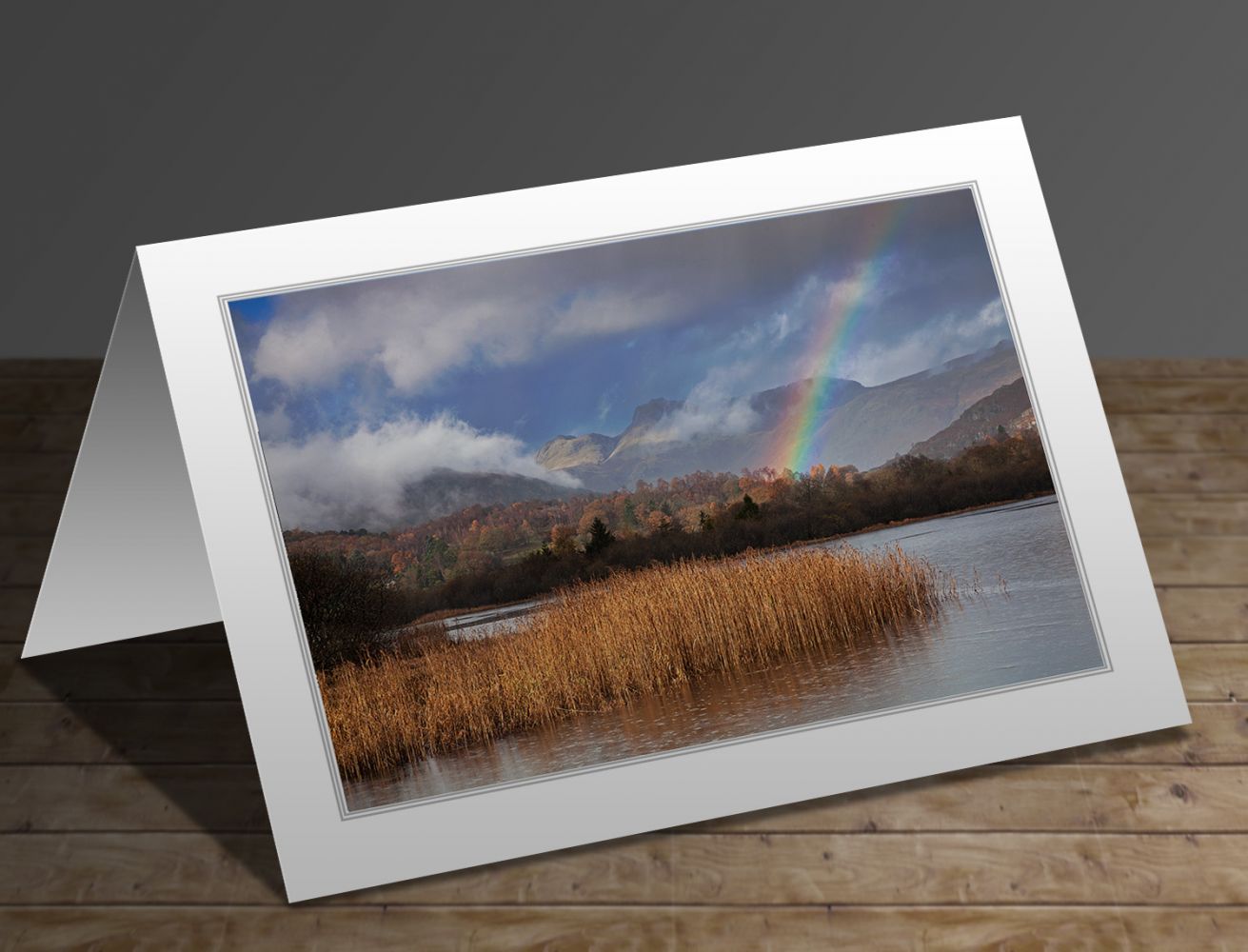 A greetings card containing the image Langdales rainbow at Elterwater Tarn by Martin Lawrence