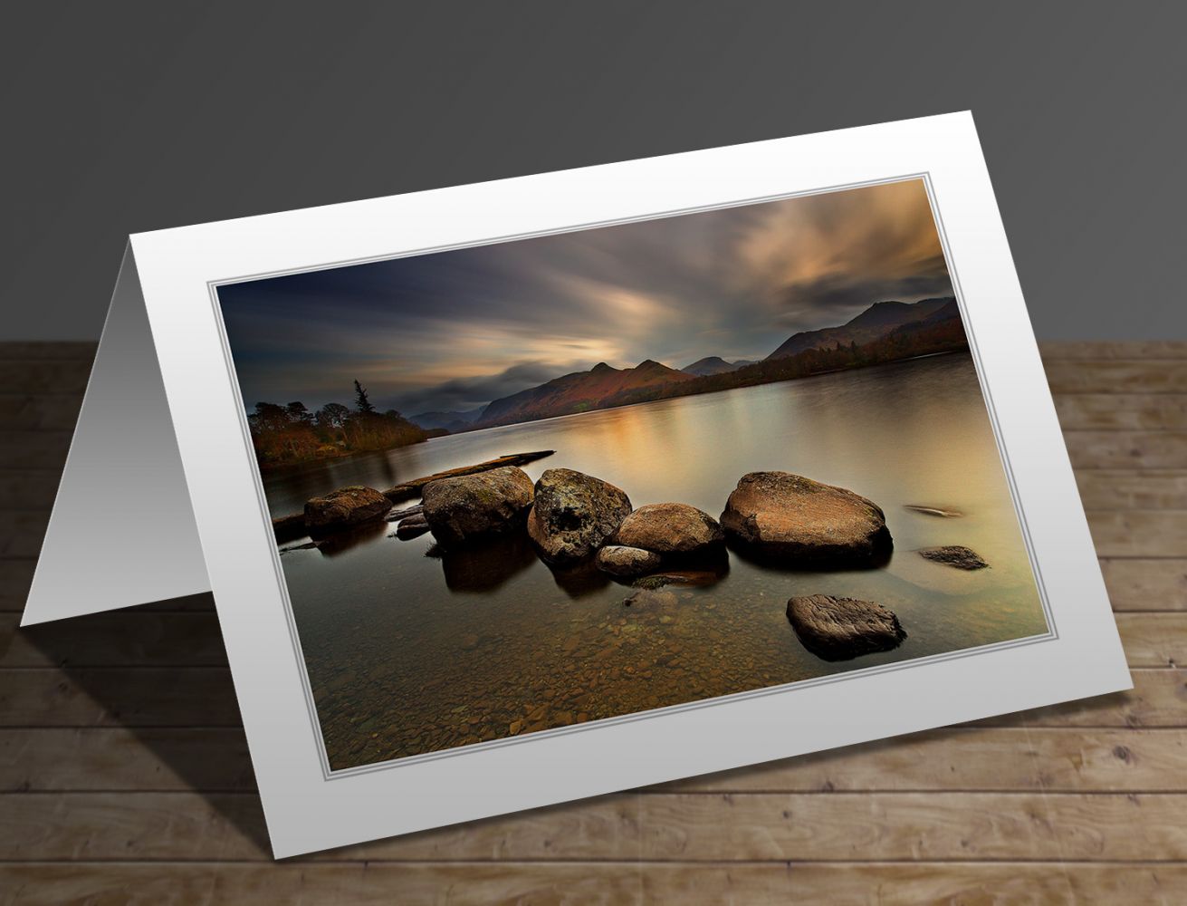 A greetings card containing the image Last rays of light over Isthmus Bay Derwentwater by Martin Lawrence