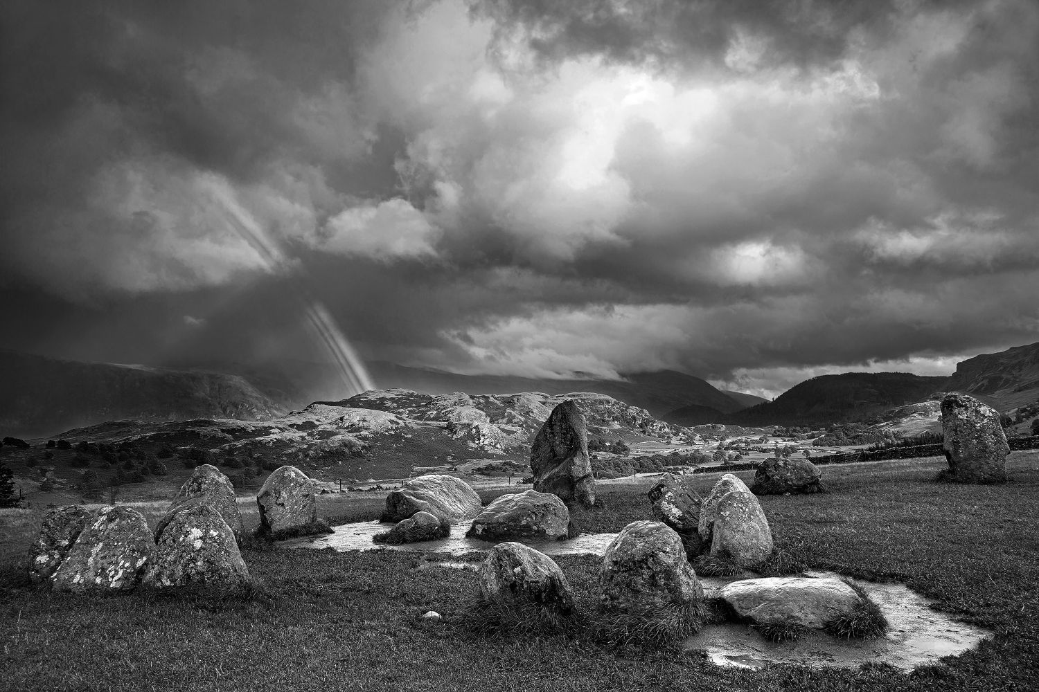 Rainbow over The Castlerigg Stone Circle in Black and White