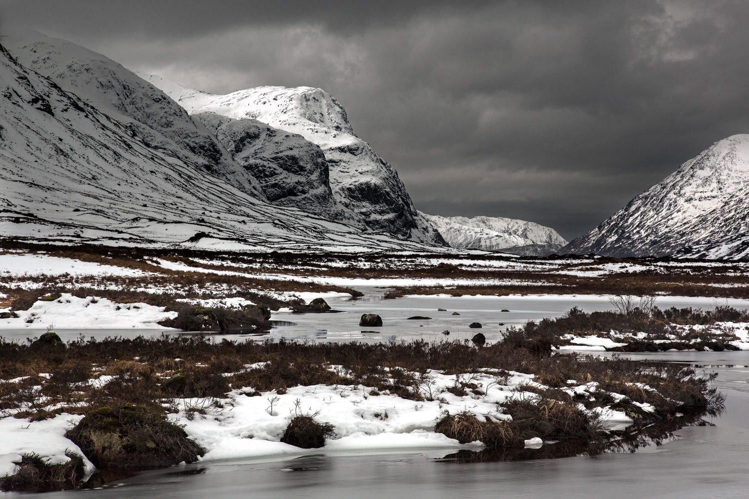 Looking down the Glencoe valley to see the Last light on the Three Sisters from Lochan na Fola.