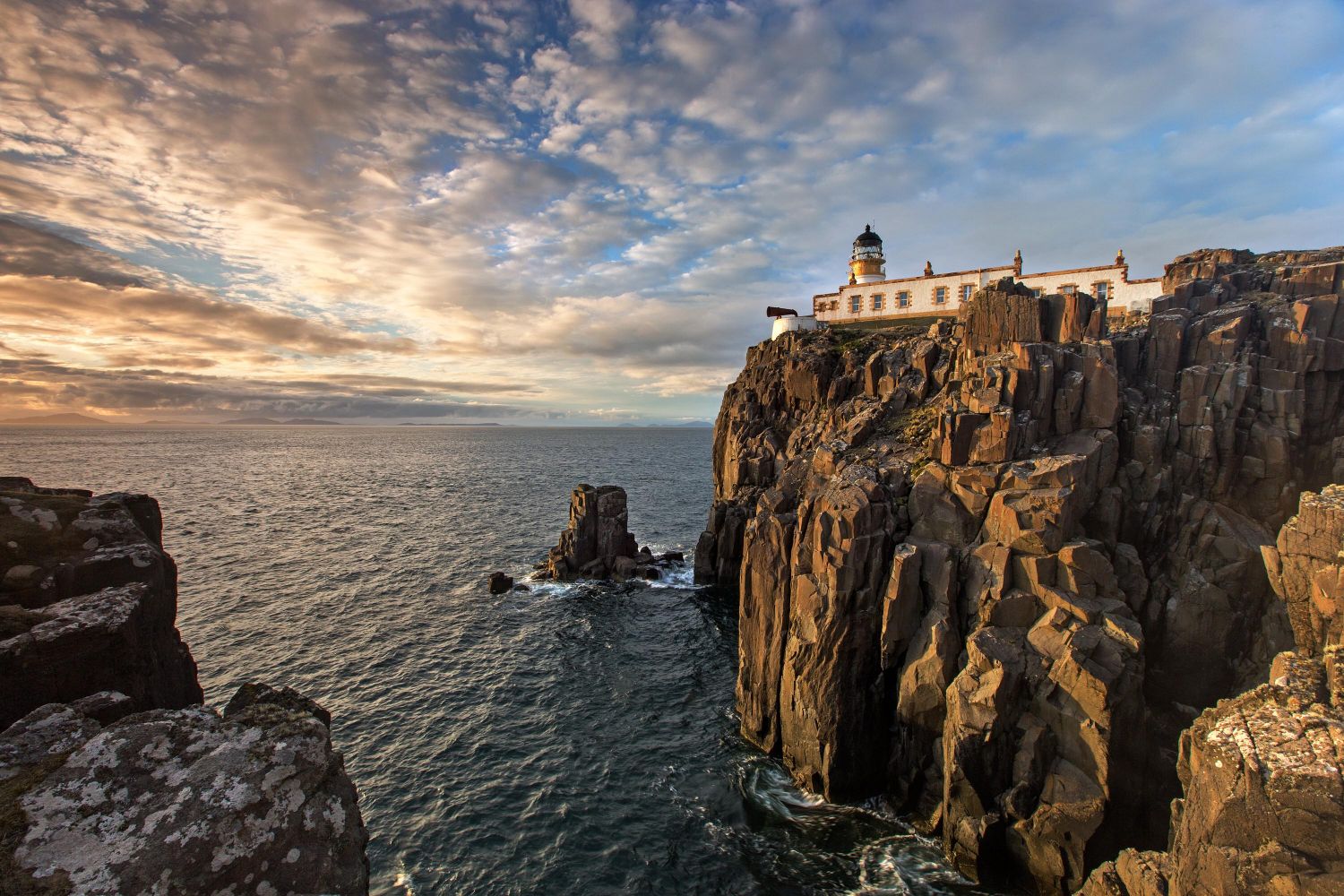 Sunset at Neist Point lighthouse on Isle of Skye's most westerly peninsula