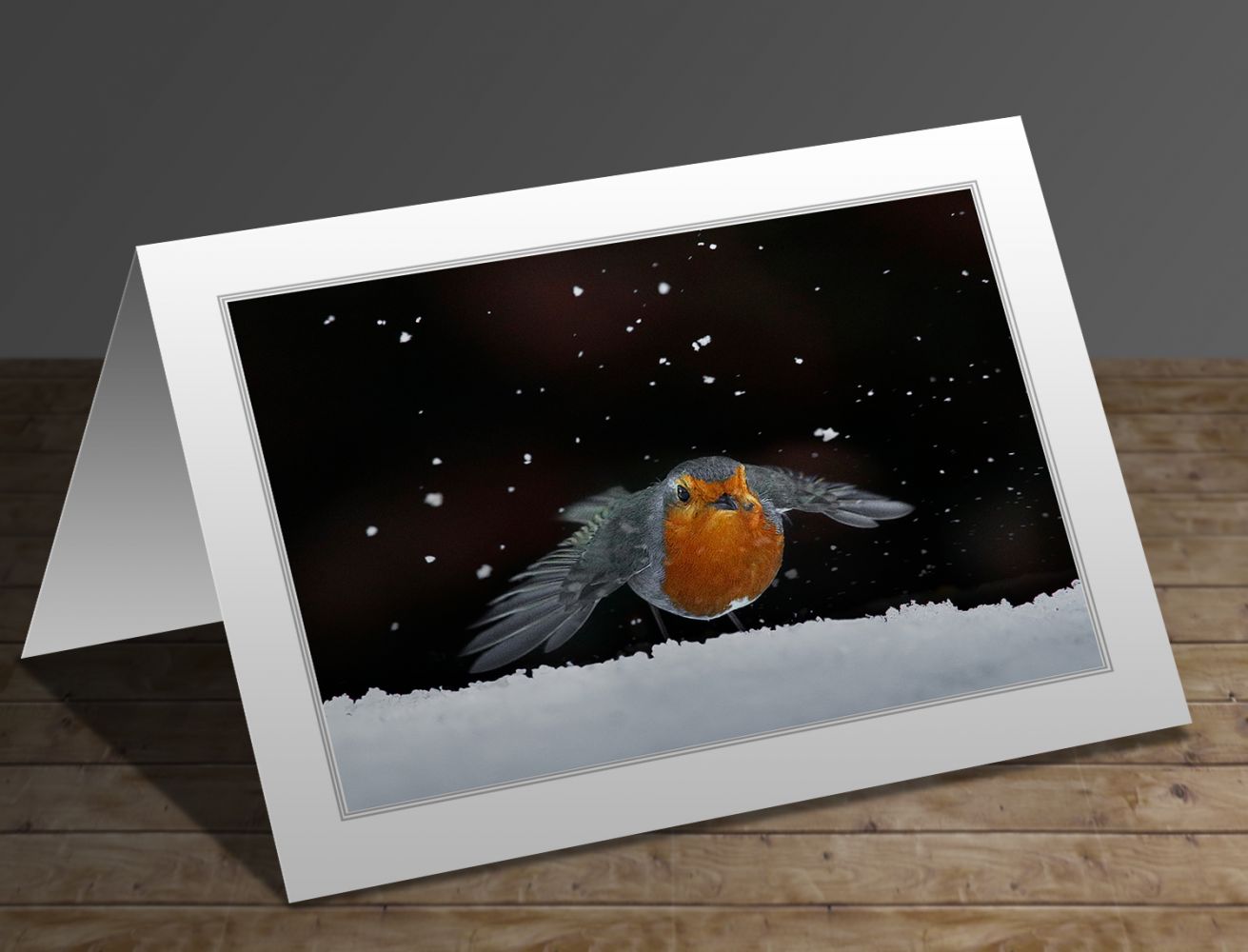 A greetings card containing the image Robin amongst the snow by Wildlife Photographer Martin Lawrence