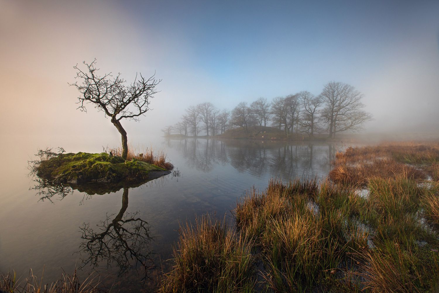 Sunrise through the mist on Rydal Water by Martin Lawrence Photography