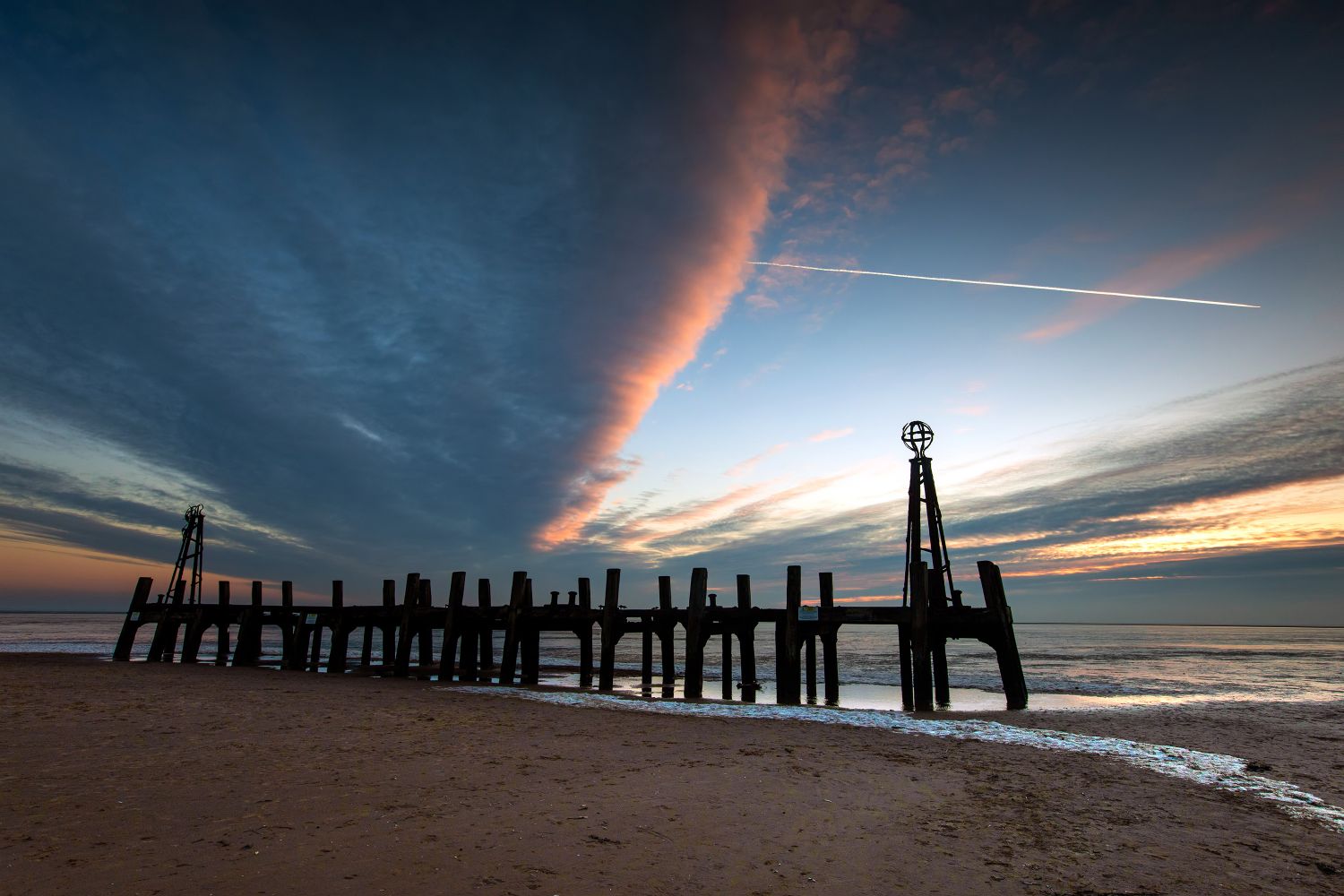 Sunset and Trails over St Annes Jetty by Martin Lawrence Photography