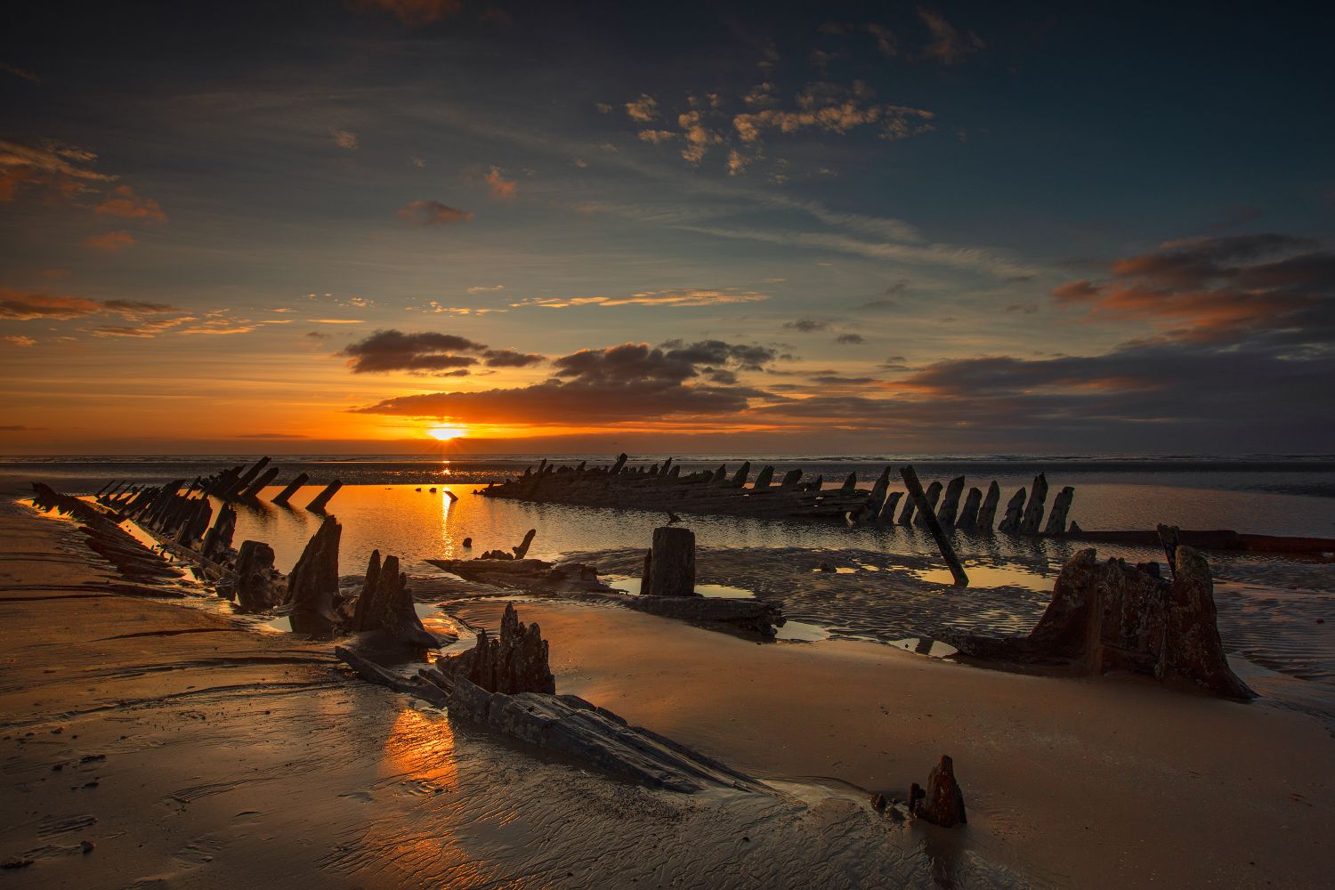 Sunsets over The Abana Ship Wreck off The Fylde Coast by Martin Lawrence