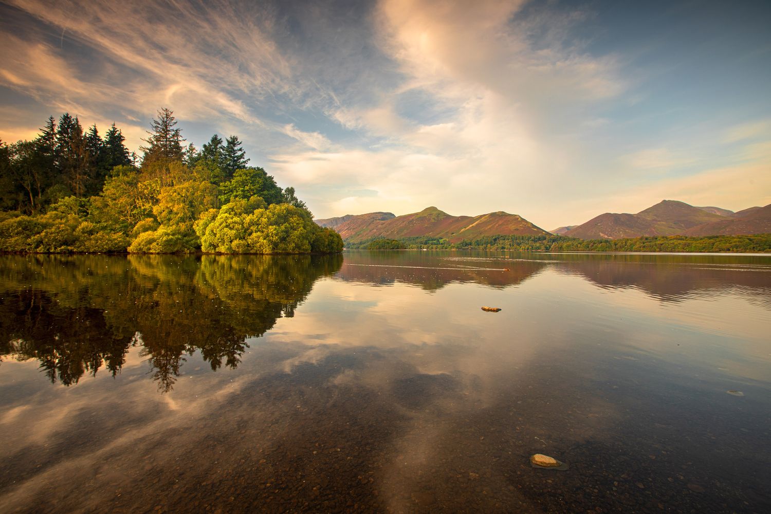 The beginning of autumn across Derwentwater by Martin Lawrence Photography
