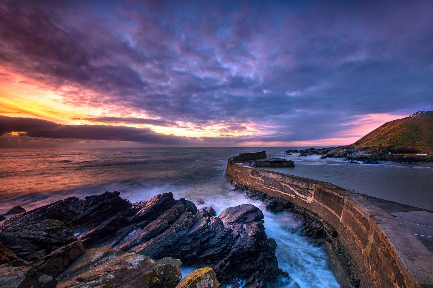 Sunrise over Collieston Harbour near Aberdeen by Martin Lawrence