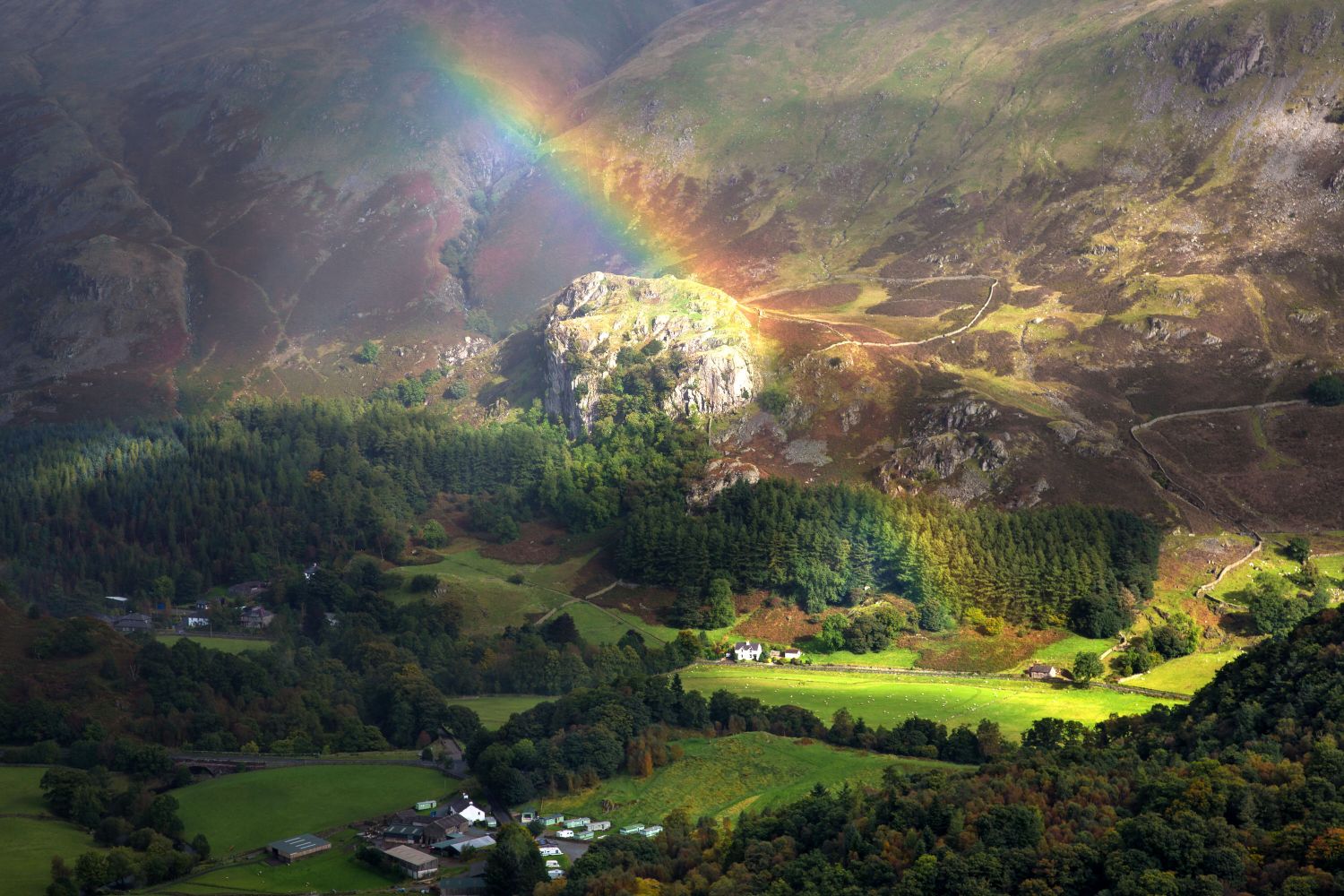  A beautiful rainbow ends over Castle Rock of Triermain in St Johns in the Vale in the English Lake District