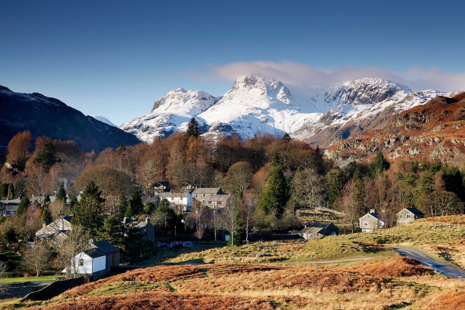 Snow on the Langdale Pikes from Elterwater Village in the English Lake District