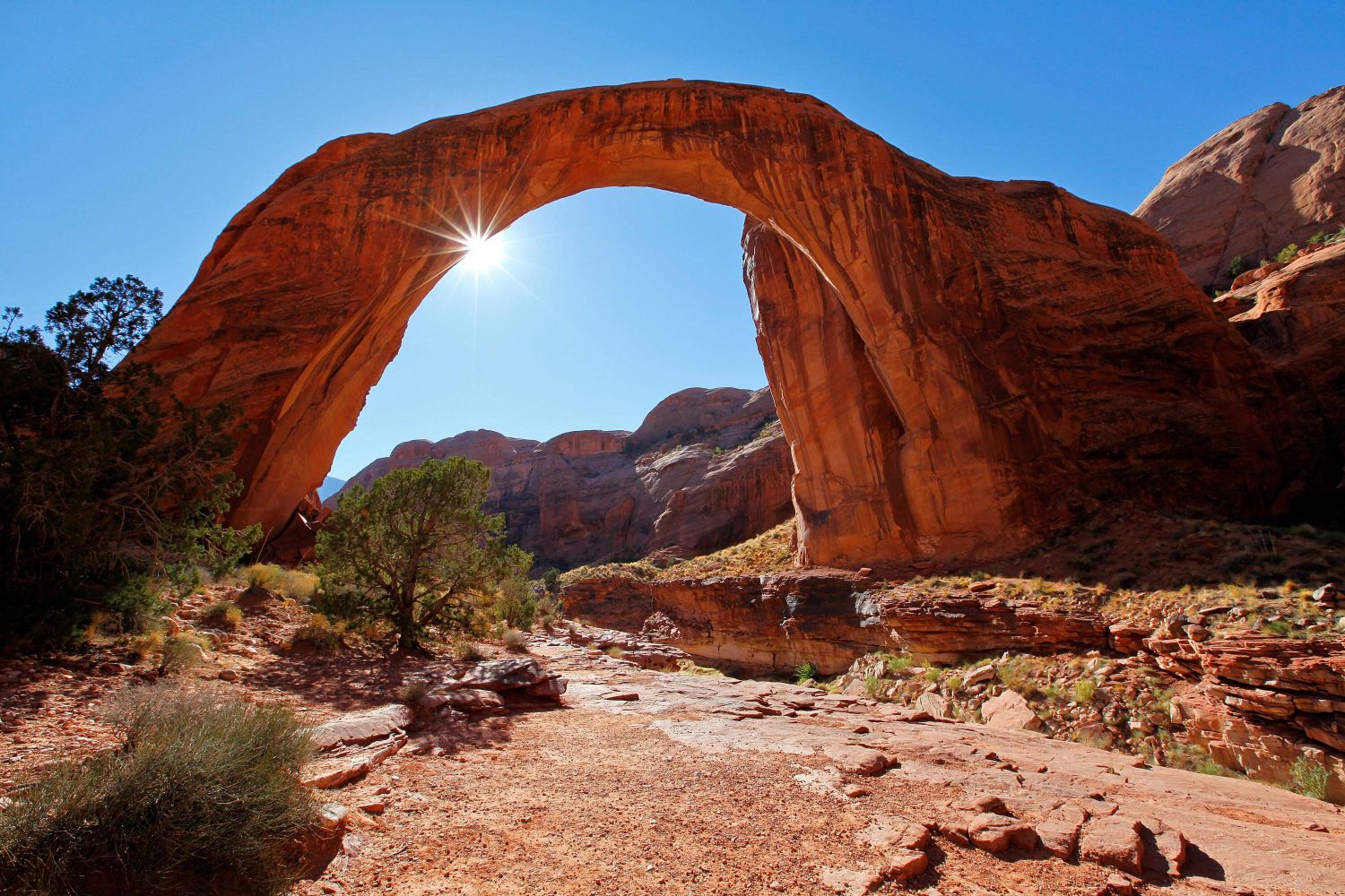 Sun sneaking through Rainbow Bridge National Monument