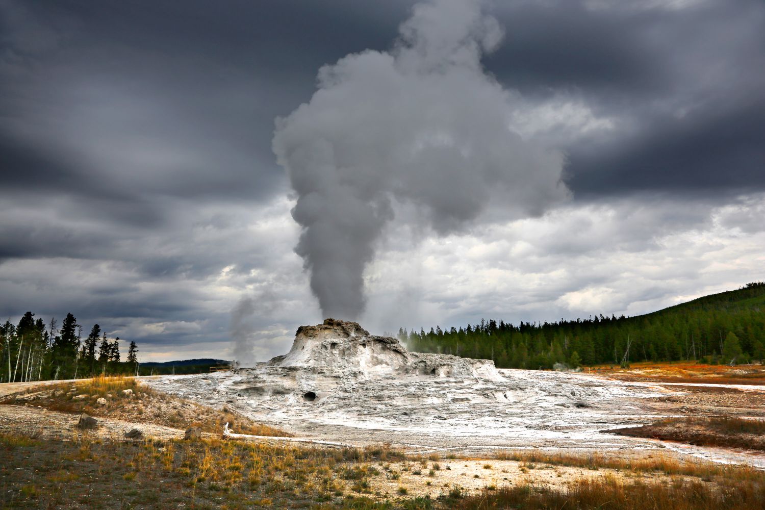 Castle Geyser Yellowstone erupting shortly before an impending storm