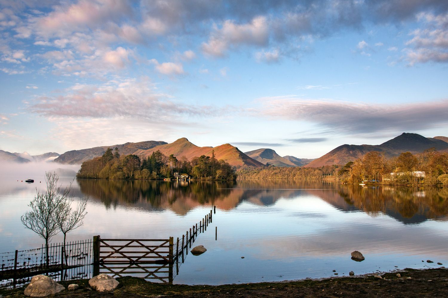 Derwentwater sunrise with Catbells and Causey Pike beautifully reflected in the lake