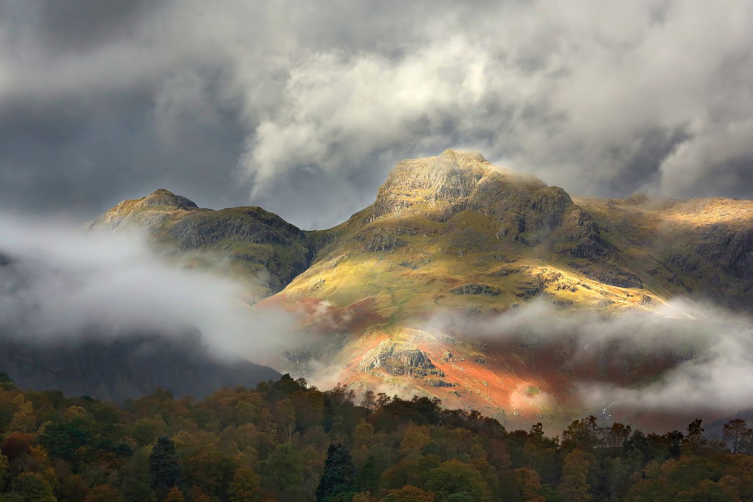 Low cloud surrounding Harrison Stickle and Loft Crag part of  the Langdale Pikes