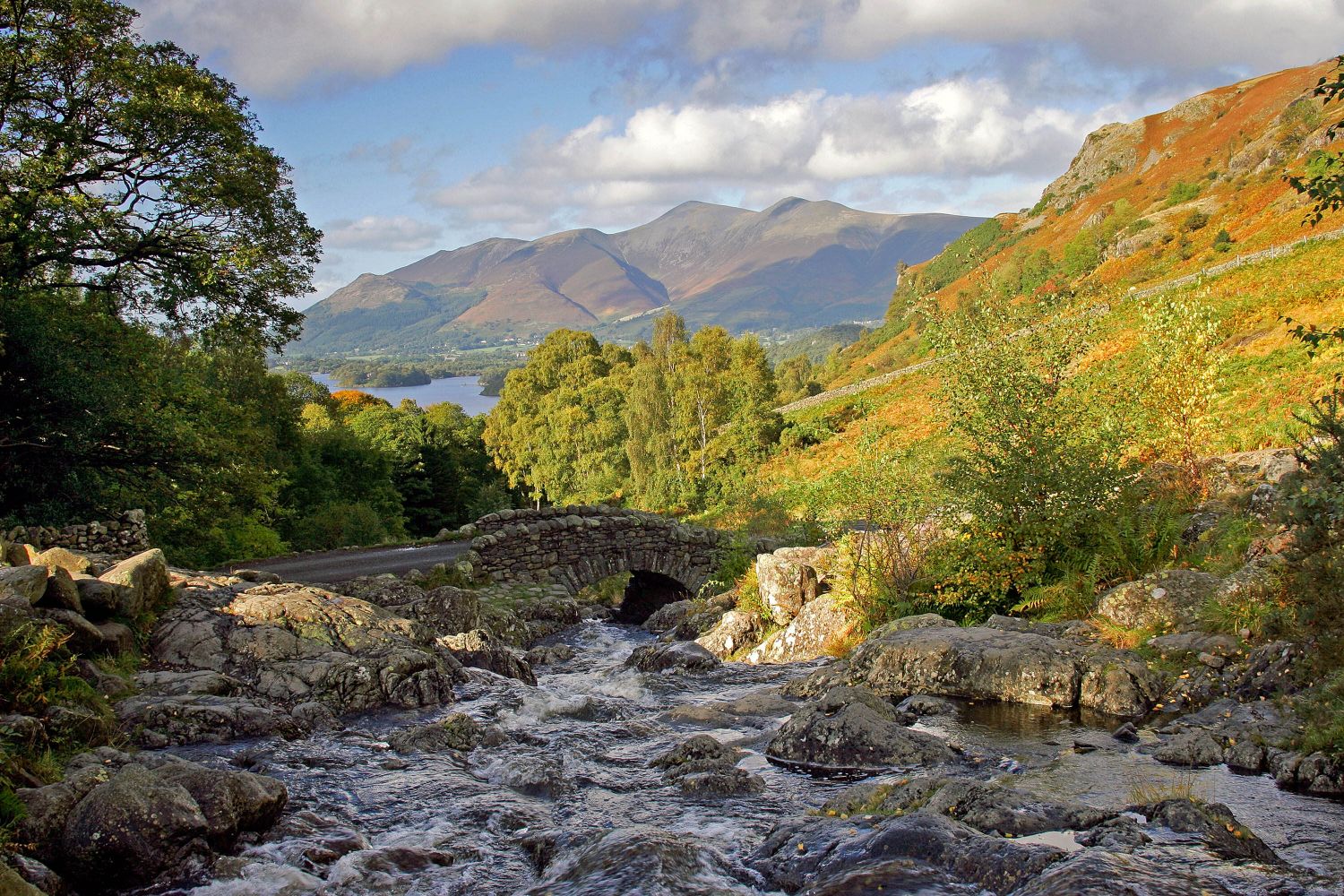 Autumn sunshine at Ashness Bridge, Derwentwater an iconic packhorse bridge in the English Lake District