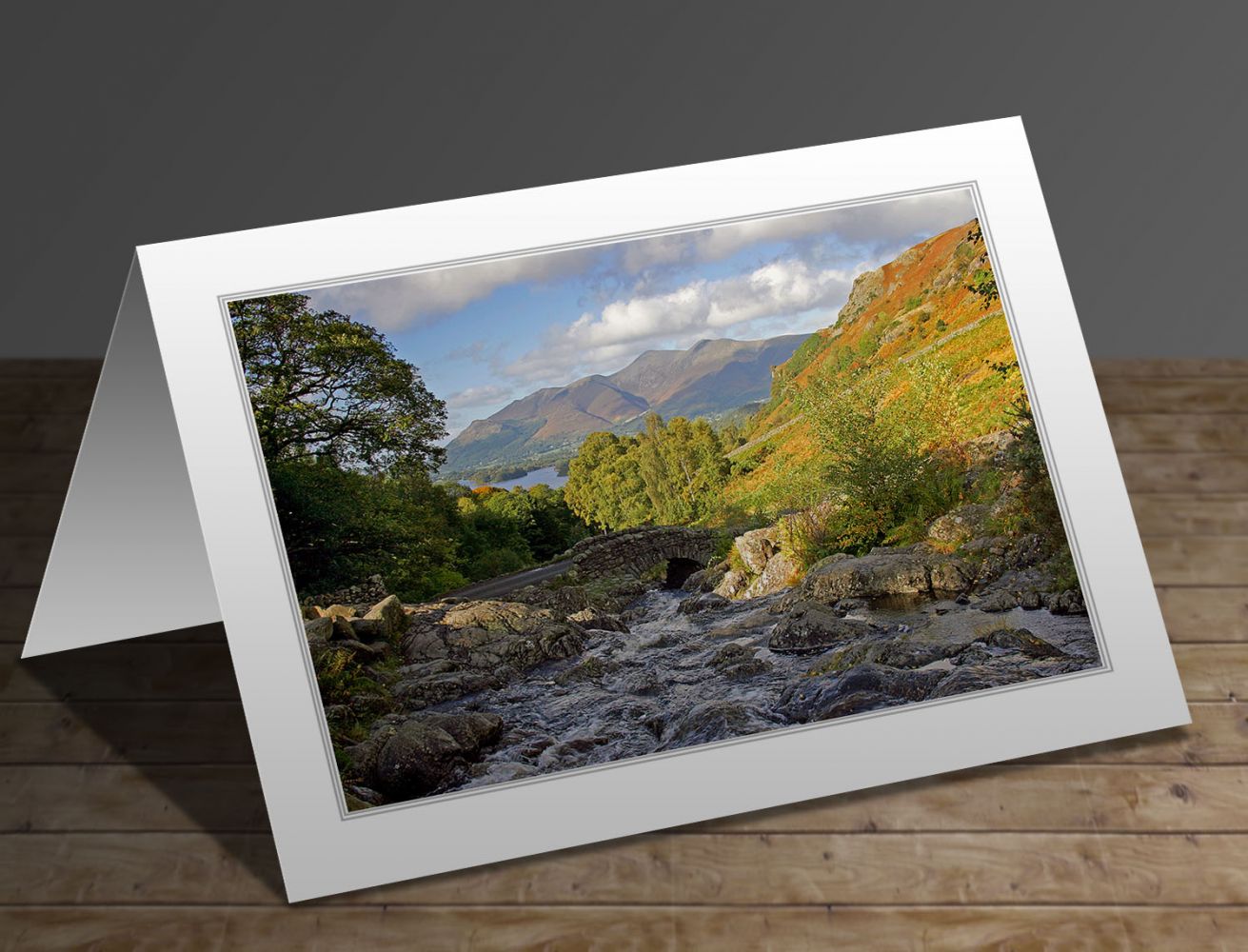 A greeting card containing the image Autumn sunshine at Ashness Bridge in the English Lake District by Martin Lawrence