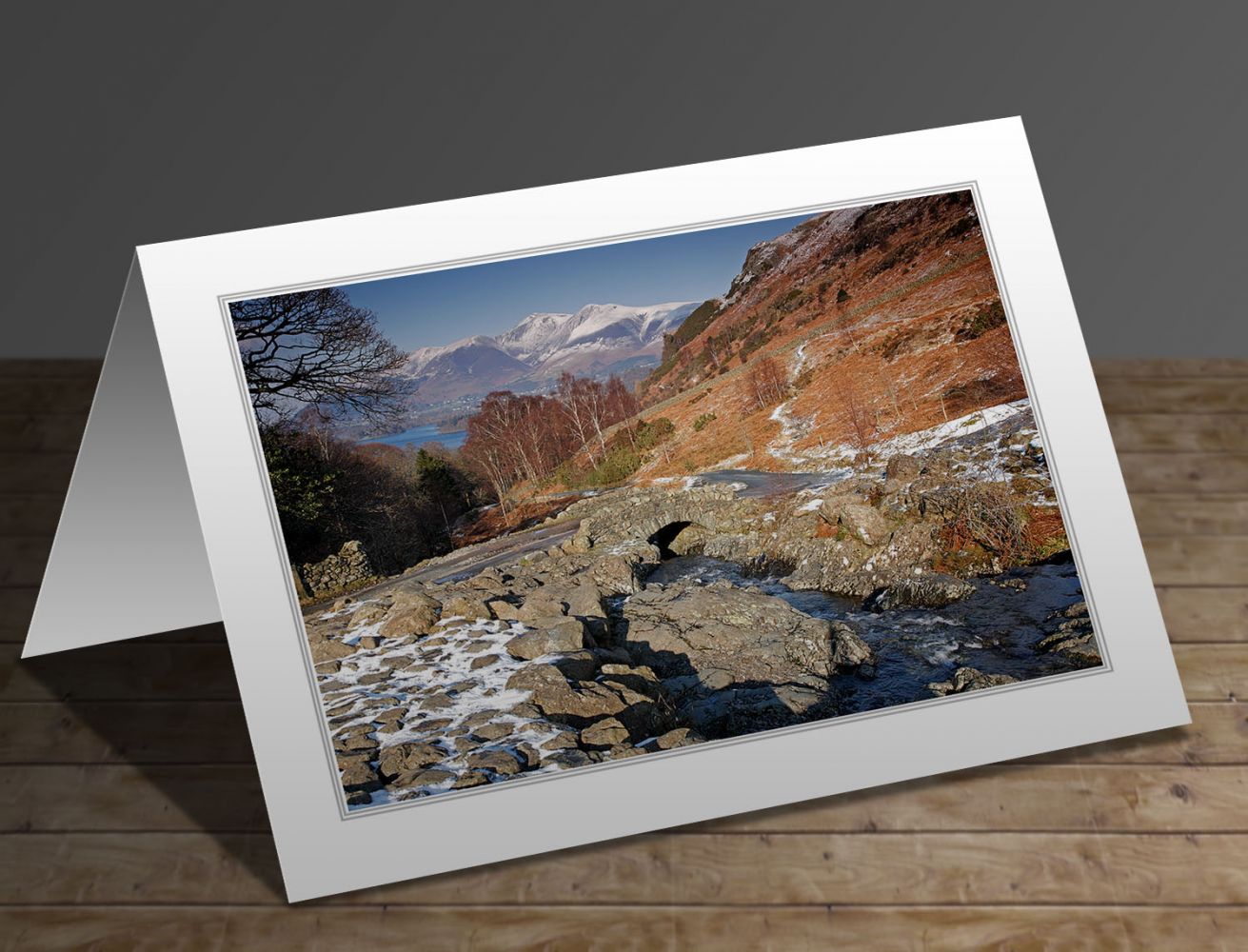 A greeting card containing the image Melting snow at Ashness Bridge in the English Lake District by Martin Lawrence