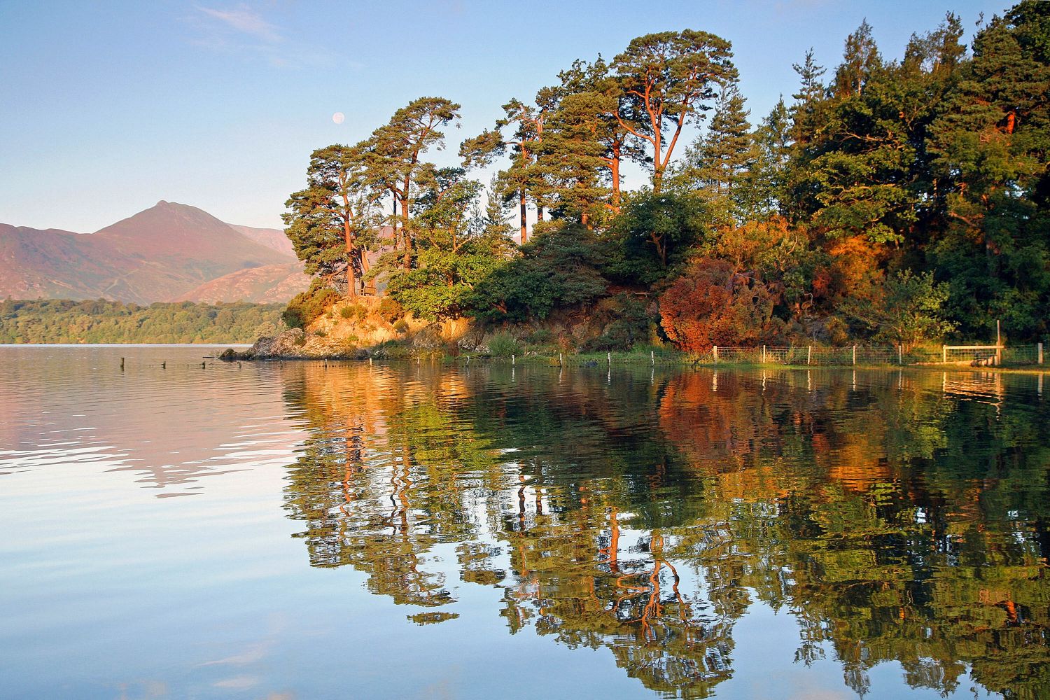 Autumn sunshine at Friars Crag with the trees reflecting beautifully in the lake.