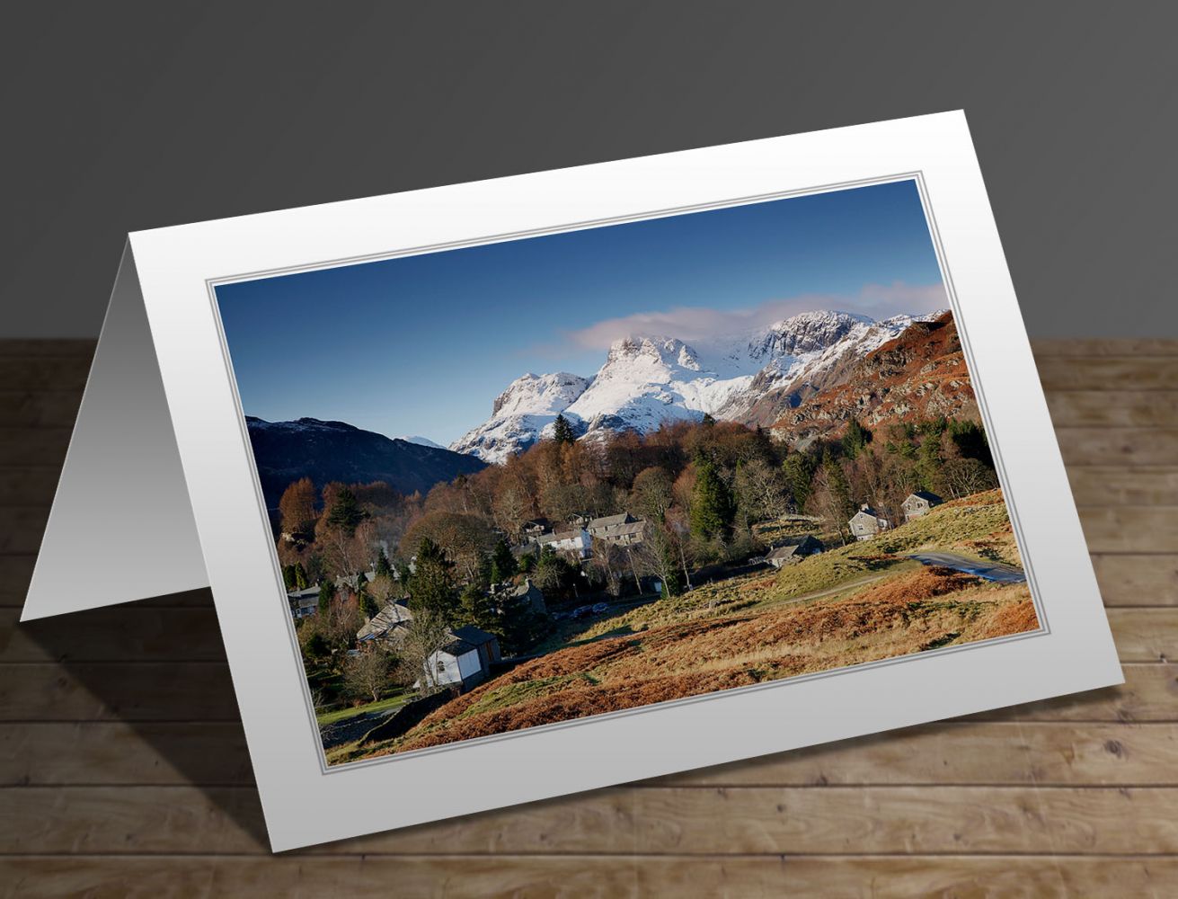 A greeting card containing the image Snow on the Langdale Pikes from Elterwater village in the English Lake District by Martin Lawrence