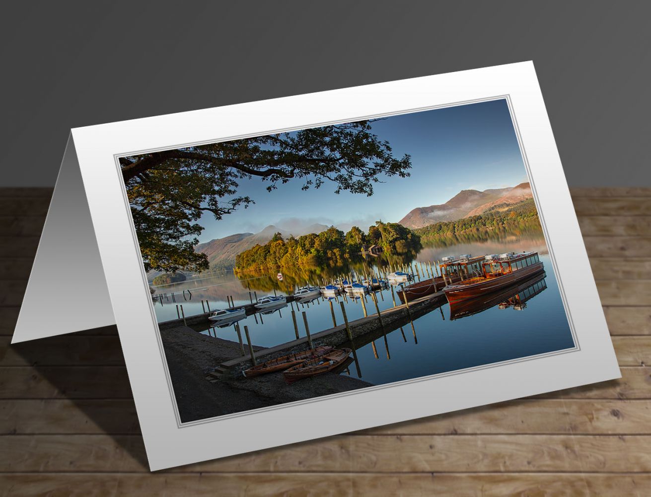 A greeting card containing the image Keswick Boat Landings on a still summer morning in the English Lake District by Martin Lawrence