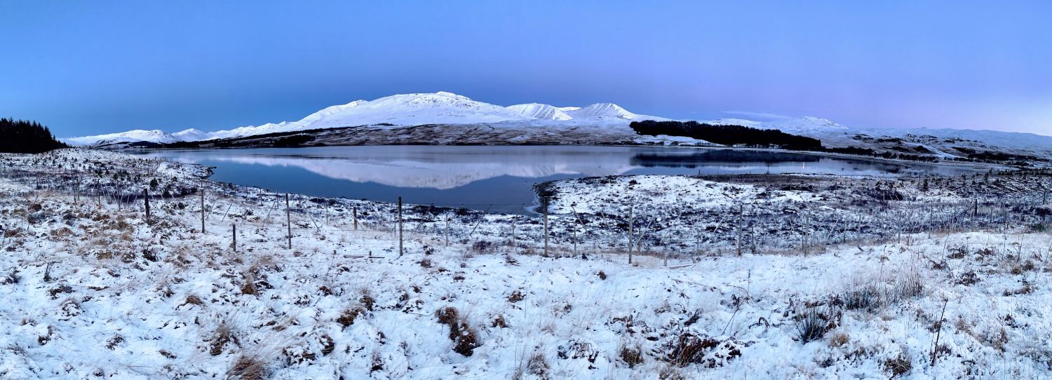 Loch Tulla on Rannoch Moor before sunrise with the Black Mount in the distance