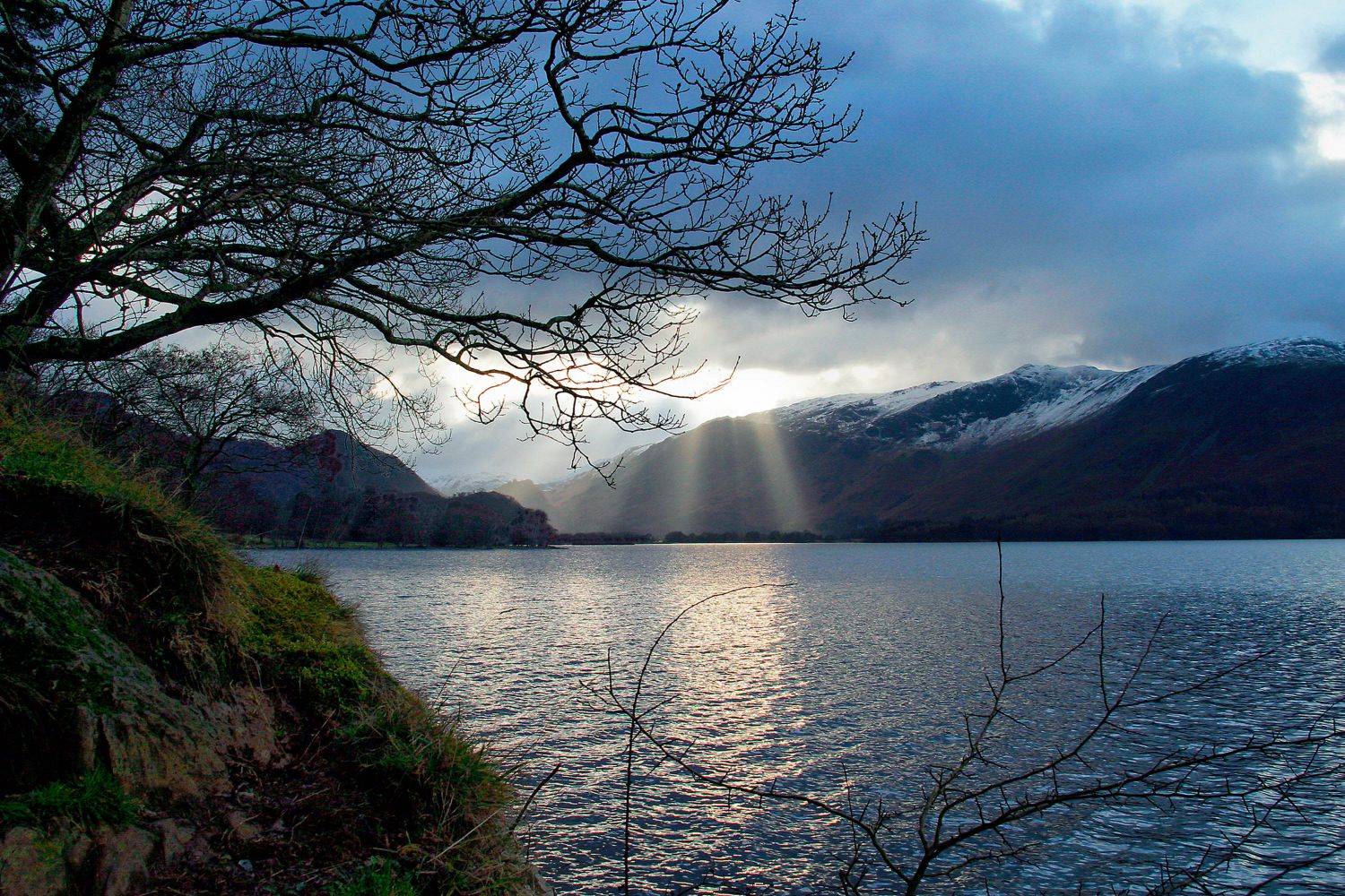 Shafts of evening light hitting Derwentwater and the surrounding fells