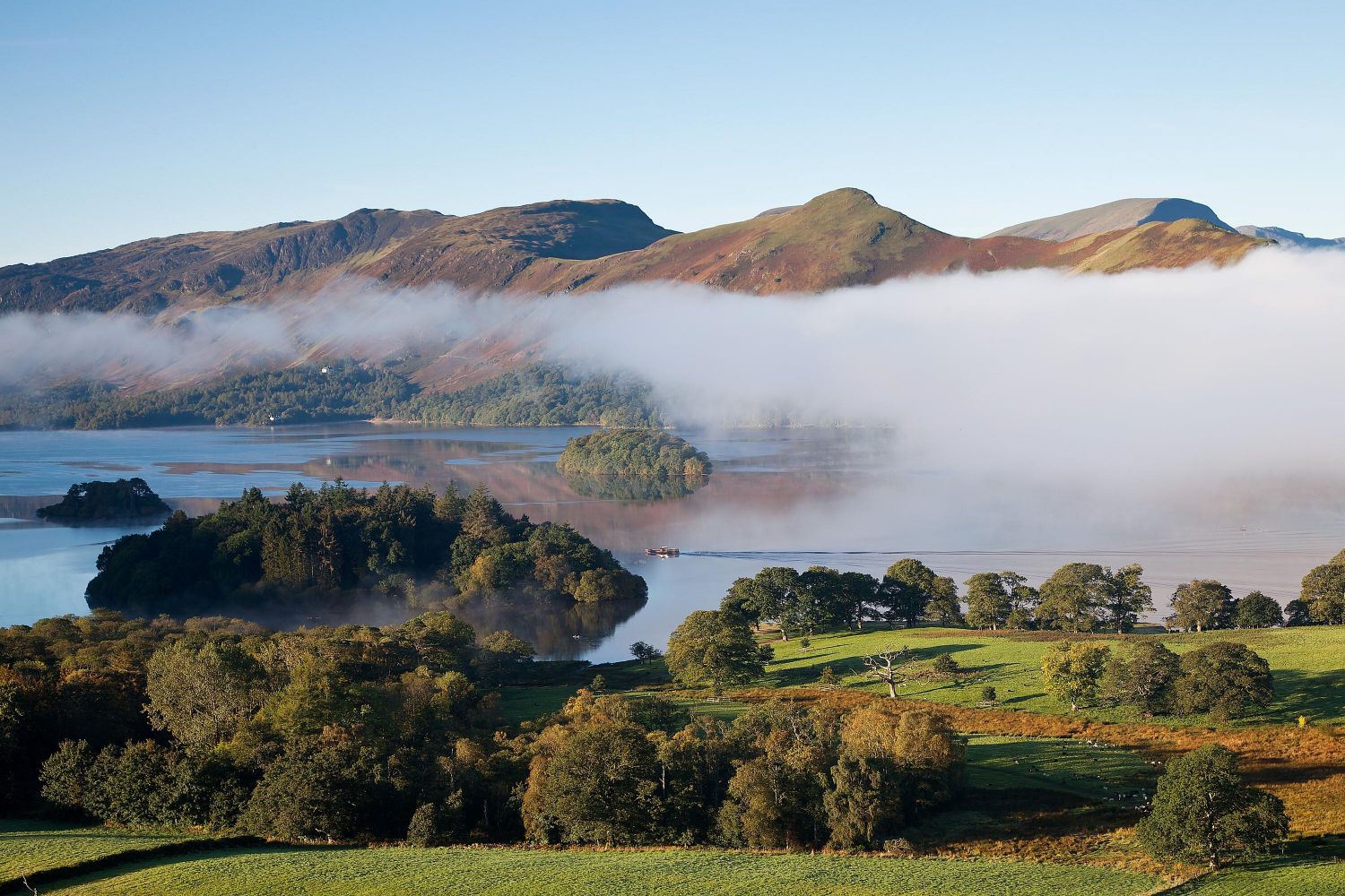 First sailing across Derwentwater of the passenger ferry around the lake.